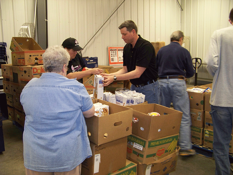 Missouri Rotarians volunteer for Mobile Food Pantry and Backpack Program